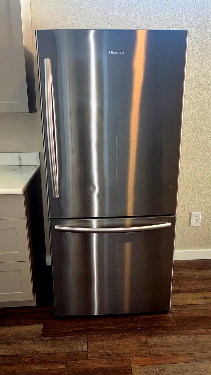 Polished stainless steel refrigerator after cleaning