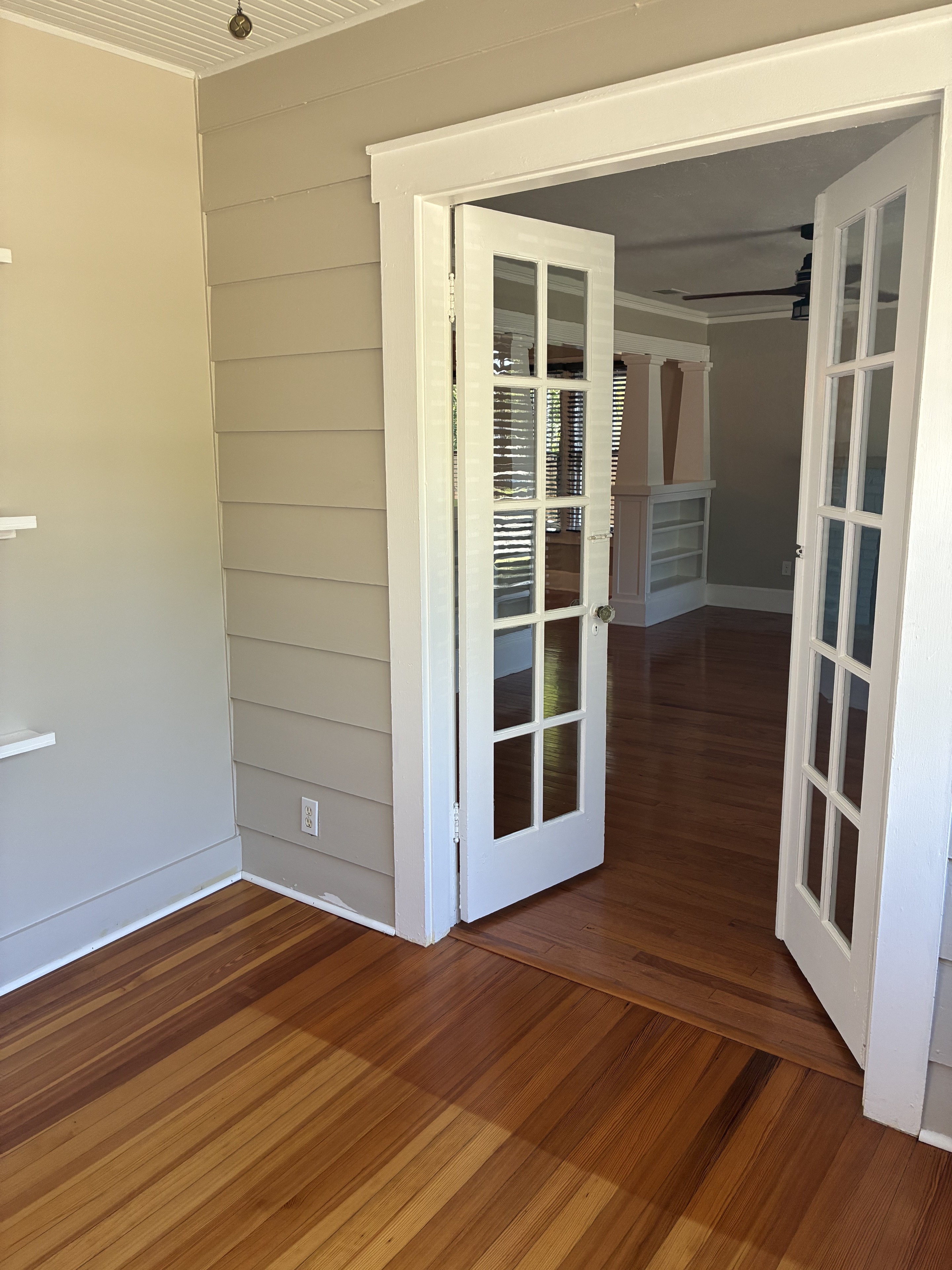 Clean French doors, trim, and hardwood threshold