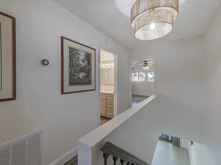 Clean stair landing and upstairs hallway